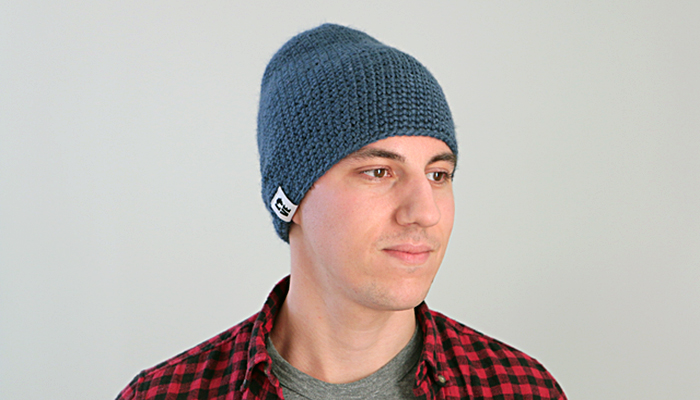 a guy wearing a blue beanie