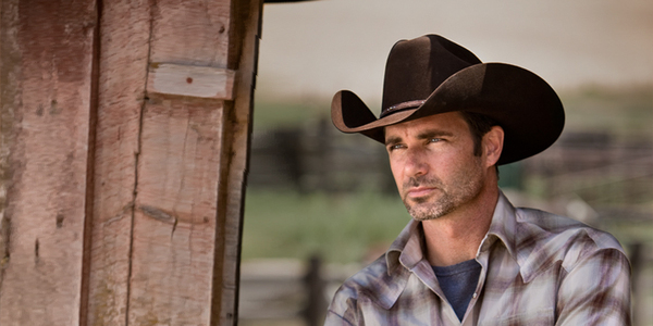 a guy wearing a cowboy hat
