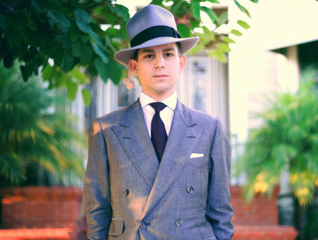 a guy wearing a fedora hat