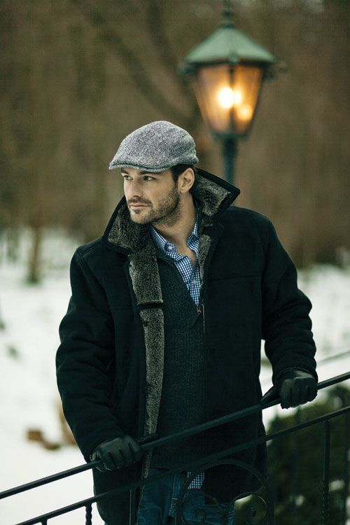 a stylish man wearing a flat cap