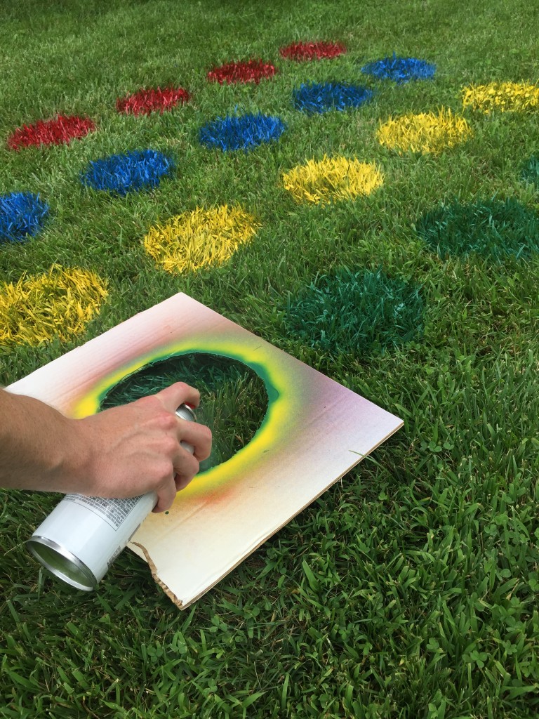painting twister board on the grass